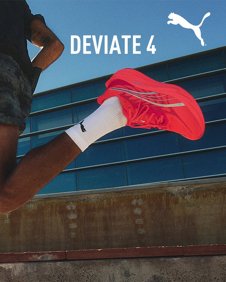 Ragazzo che corre con scarpe da running Puma Deviate Nitro 4