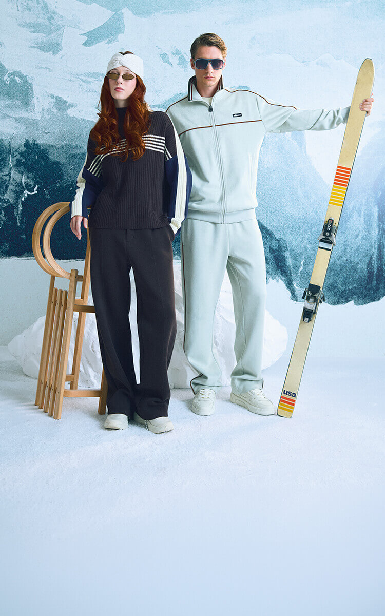 Ragazza e ragazzo che vestono con abbigliamento Ellesse invernale