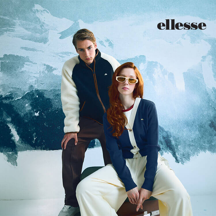 Ragazza e ragazzo vestiti con abbigliamento Ellesse invernale
